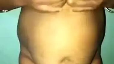 Desi woman with sexy fat tummy and big tits spreads pussy in XXX video