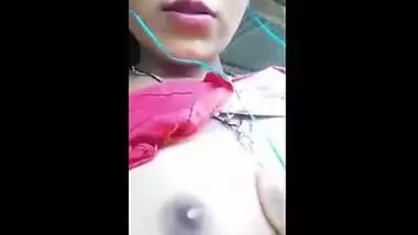Beautiful teen plays with her firm boobs while on a video call with lover