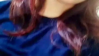 Beautiful girl lifting dress and showing big boobs