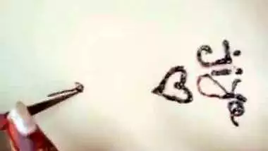 Nude girl puts henna on her naked body during a video call sex