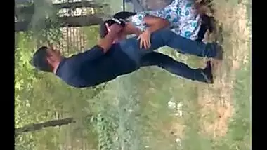 Records a young couple enjoying oral sex behind their house