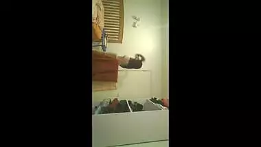 Filmign sexy cousin changing in bedroom