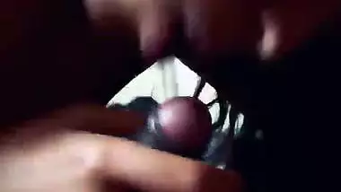 Slim girlfriend smiling while giving handjob and blowjob