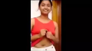 Desi quickly pulls up her T-shirt exposing XXX boobies upon sex request