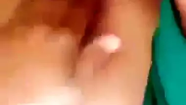 Horny girl squeezes her boobs and fingers her hairy pussy