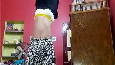 Tempting Desi teen sets camera to film her sex belly during XXX changing